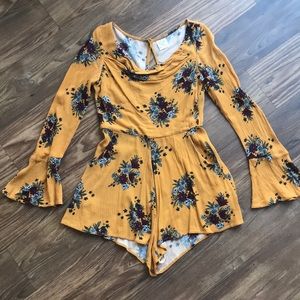 Super cute mustard yellow romper with flowers